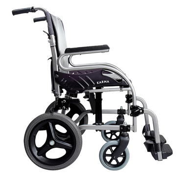 The Karman Healthcare STAR 2 Lightweight Folding Transport Chair features a black and silver aircraft-grade aluminum frame, large rear wheels, small front wheels, armrests, footrests, and visible KARMA branding on the side.