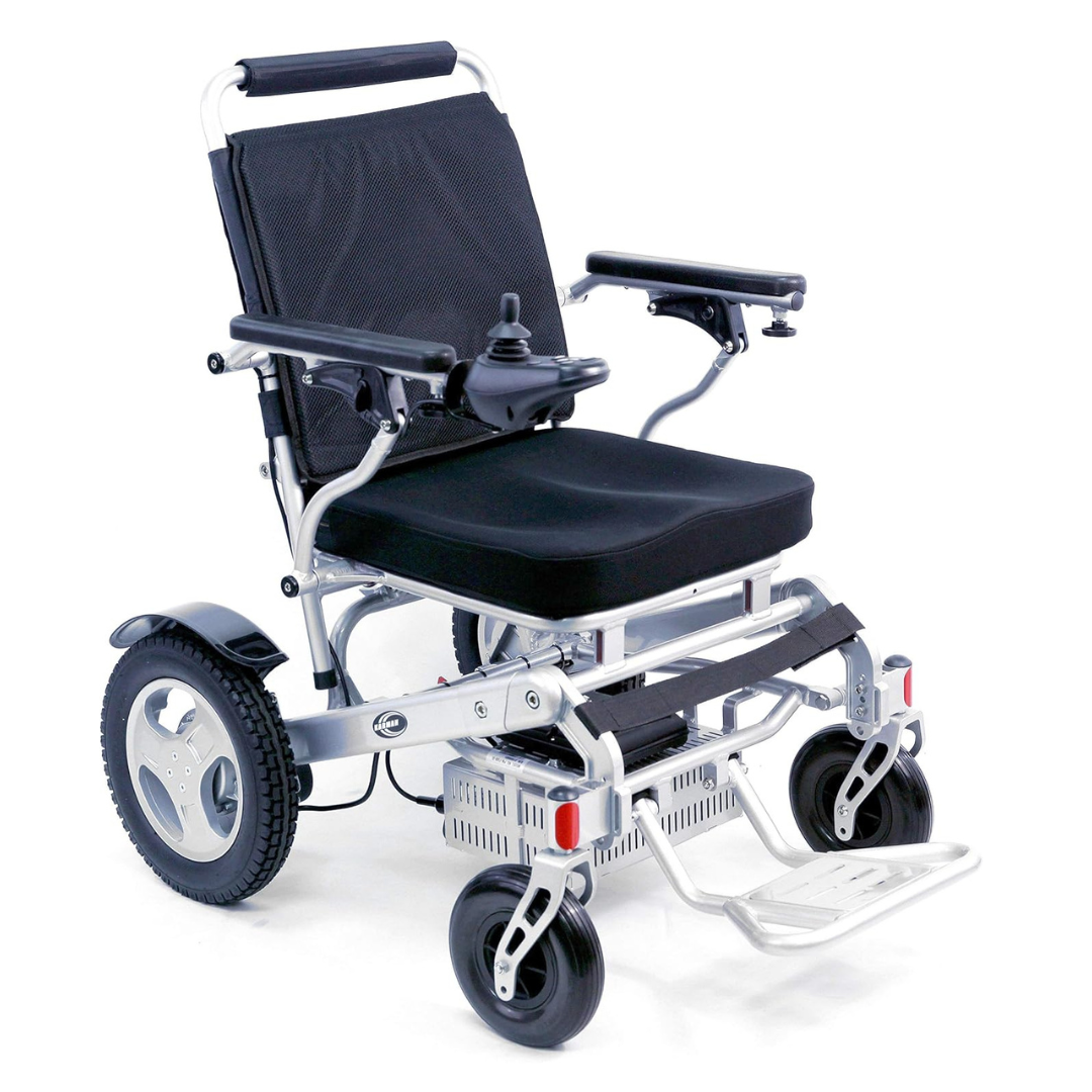 The Karman Tranzit Foldable Lightweight Power Wheelchair, FAA Approved, features a black seat and backrest, armrests with a right-side joystick, footrests, large rear wheels paired with smaller front ones, providing compact mobility convenience.