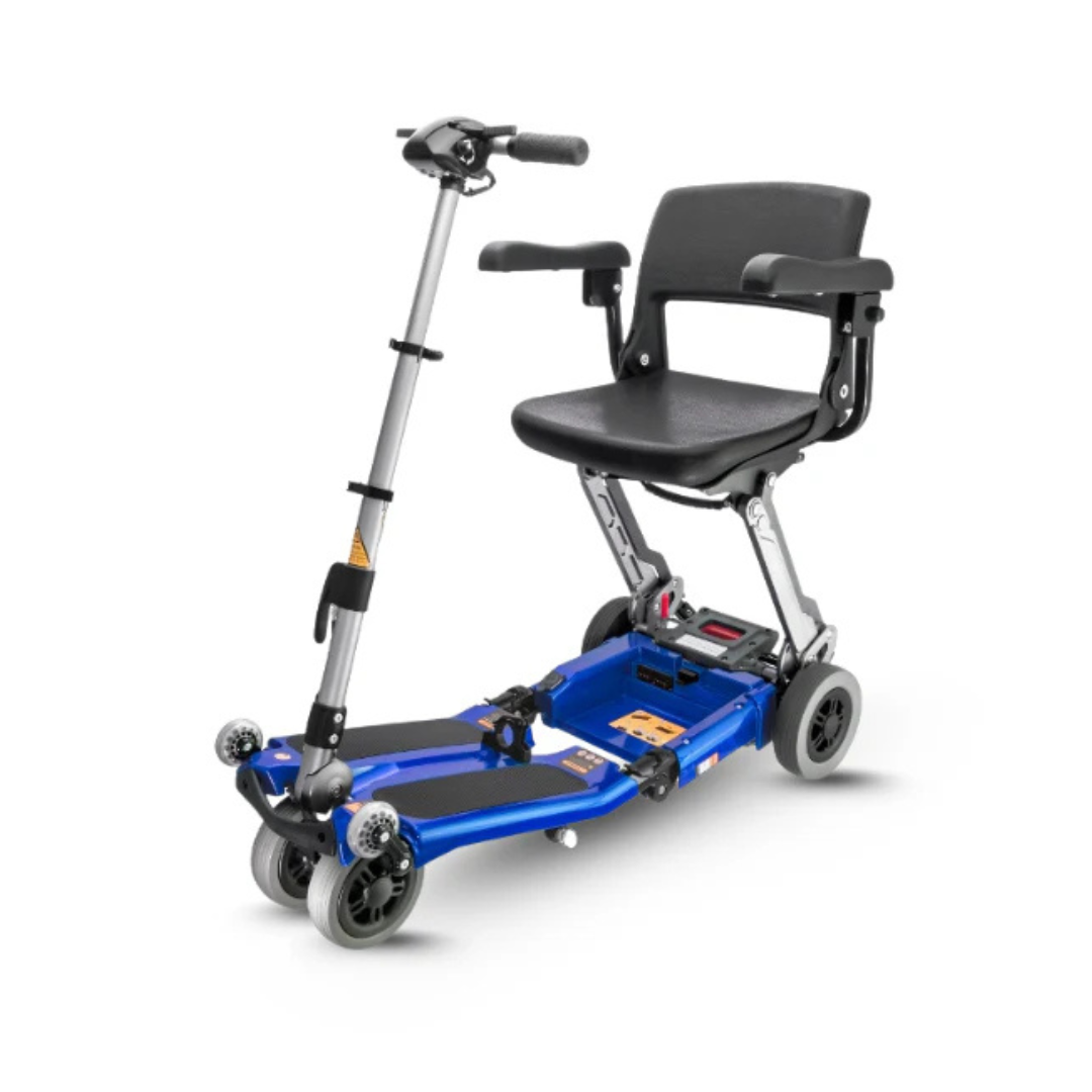 The FreeRider Luggie Elite Travel Scooter is a blue, lightweight, foldable, airline-approved mobility scooter with a black cushioned seat, armrests, and four wheels—designed for easy transport and use by individuals with mobility challenges.