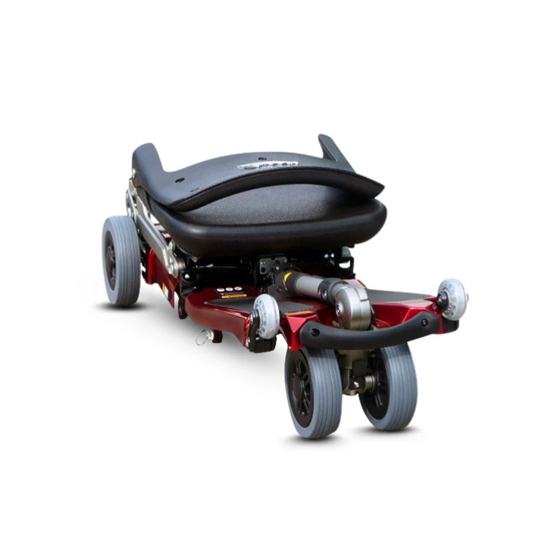 The FreeRider Luggie Elite Travel Scooter features a compact, foldable design with a red frame and black seat, shown folded on a white background—ideal as an airline-approved mobility scooter for travel.