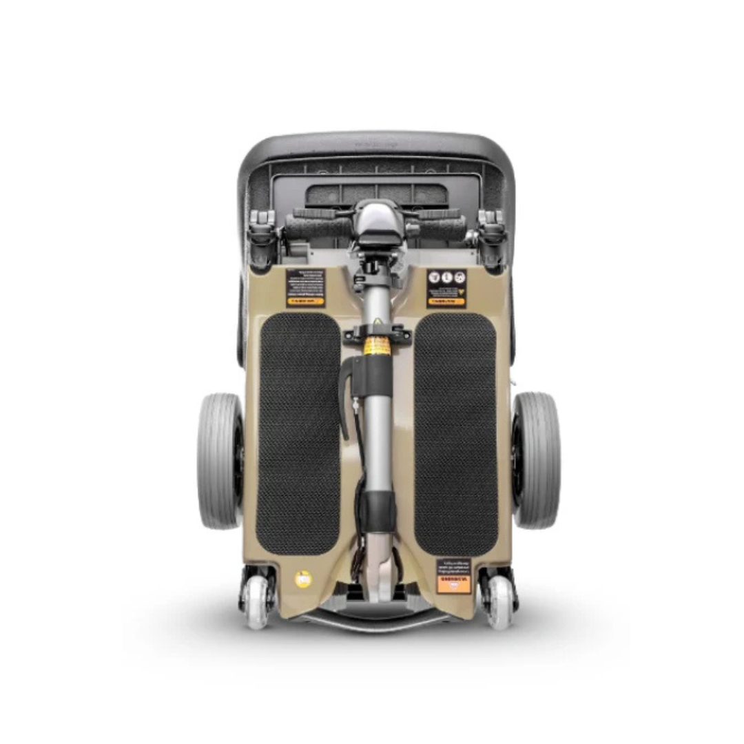 The FreeRider Luggie Elite Travel Scooter is a compact, lightweight, foldable scooter with visible wheels, handlebars, and a folded footrest—airline-approved for convenient travel—shown from above on a white background.