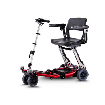 The FreeRider Luggie Elite Travel Scooter is a compact, airline-approved mobility scooter with a red frame, black seat with armrests, four wheels, and adjustable handlebars for easy transport and assistance.