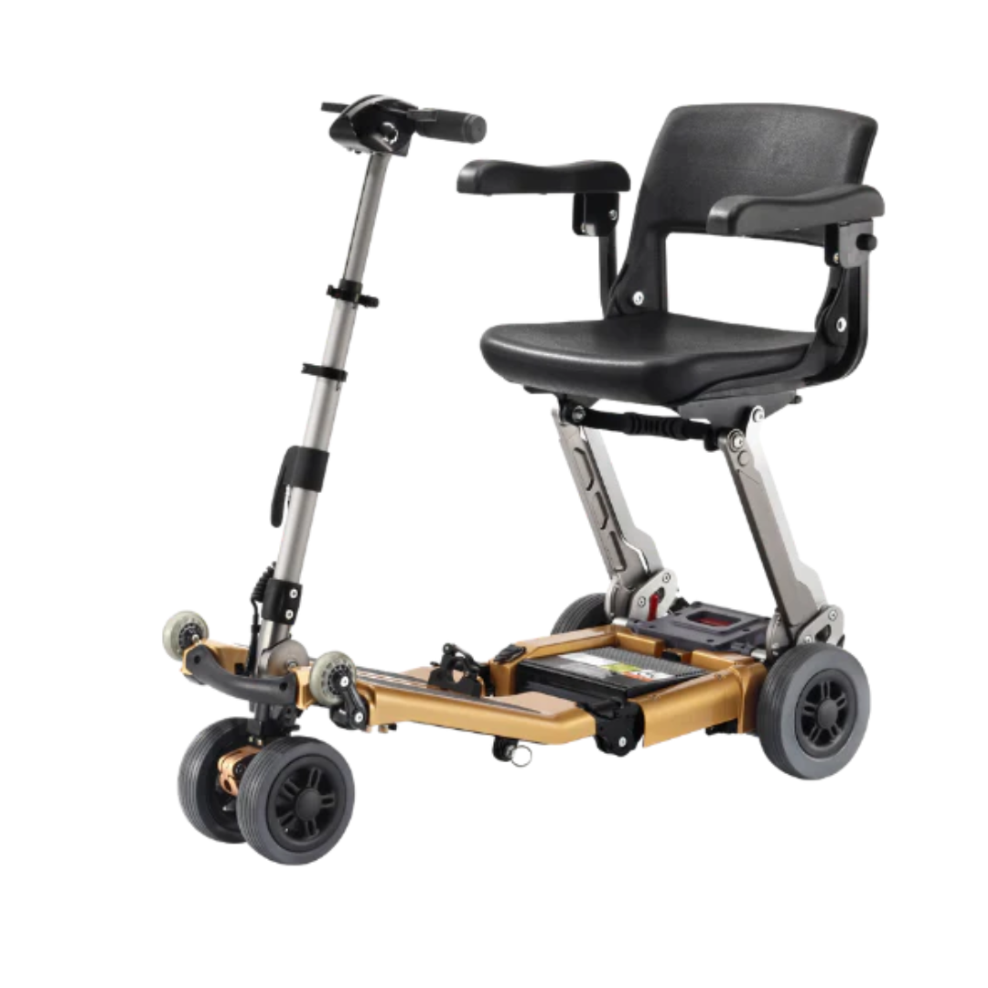 The FreeRider Luggie Golden Elite Travel Scooter is a compact, foldable, four-wheel mobility scooter with a gold frame, black seat and armrests—airline approved for convenient travel by those with mobility challenges.