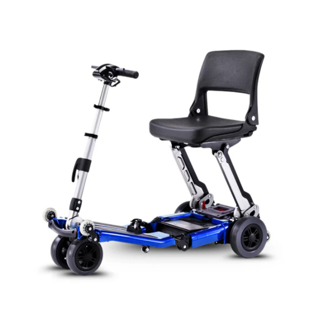 The FreeRider Luggie Standard Travel Scooter is a compact, foldable mobility scooter with a silver frame, black cushioned seat, handlebars, and four small wheels for easy transport and reliable mobility assistance.