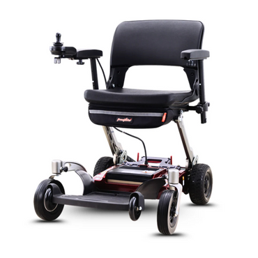 The FreeRider Luggie Travel Lightweight Powerchair features a black cushioned seat, armrests, left-side joystick controller, and four wheels—perfect for easy mobility and on-the-go comfort with its folding electric design.
