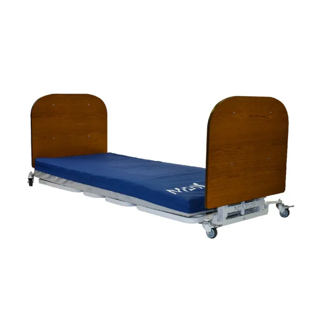 The Med-Mizer AllCare Full Electric Hi/Low Bed - Expandable Width comes with a wooden headboard and footboard, blue mattress, and caster wheels for patient care and easy mobility in hospitals.