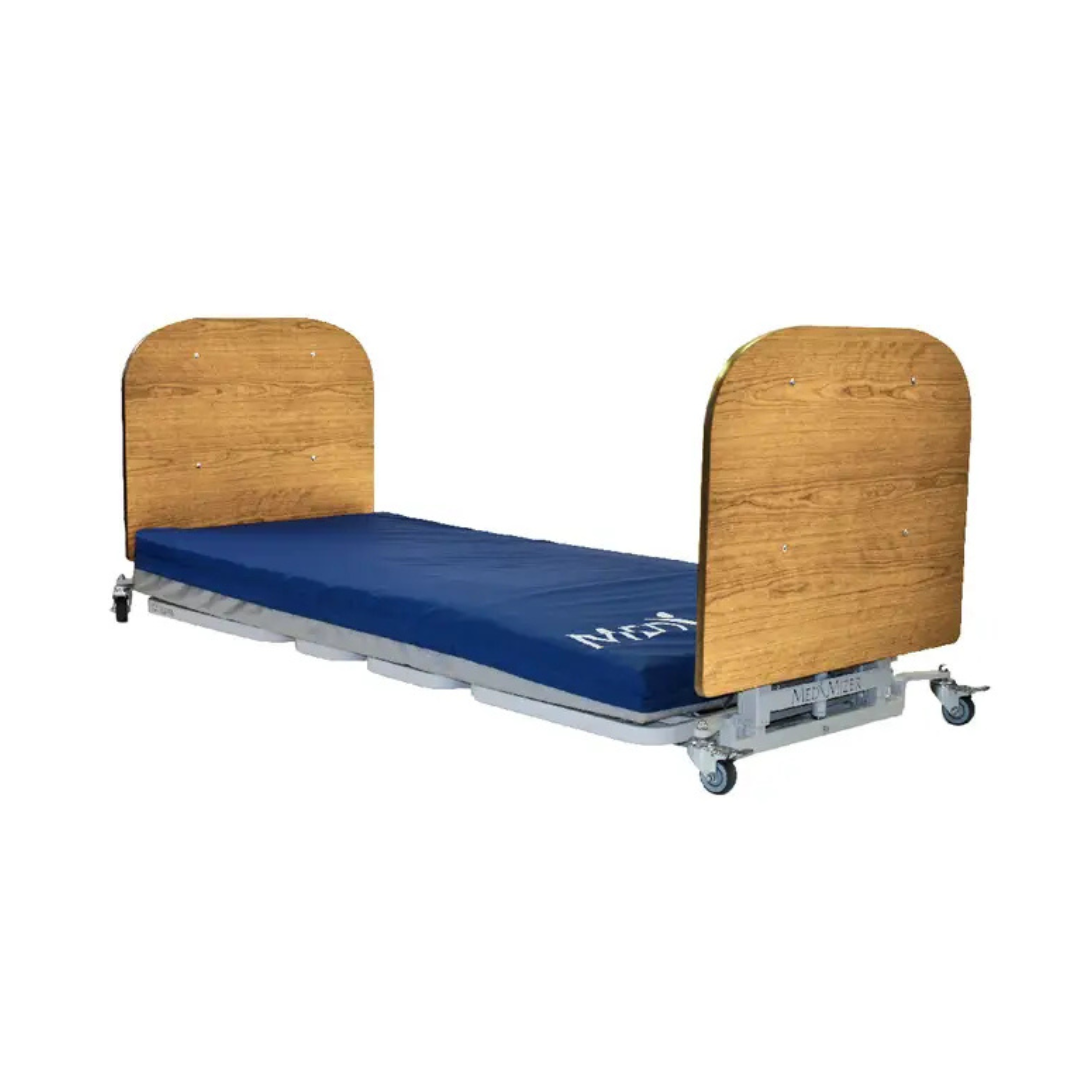 The Med-Mizer AllCare Full Electric Hi/Low Bed - Expandable Width includes a wooden headboard and footboard, blue mattress, and base wheels—perfect for medical or home care environments.