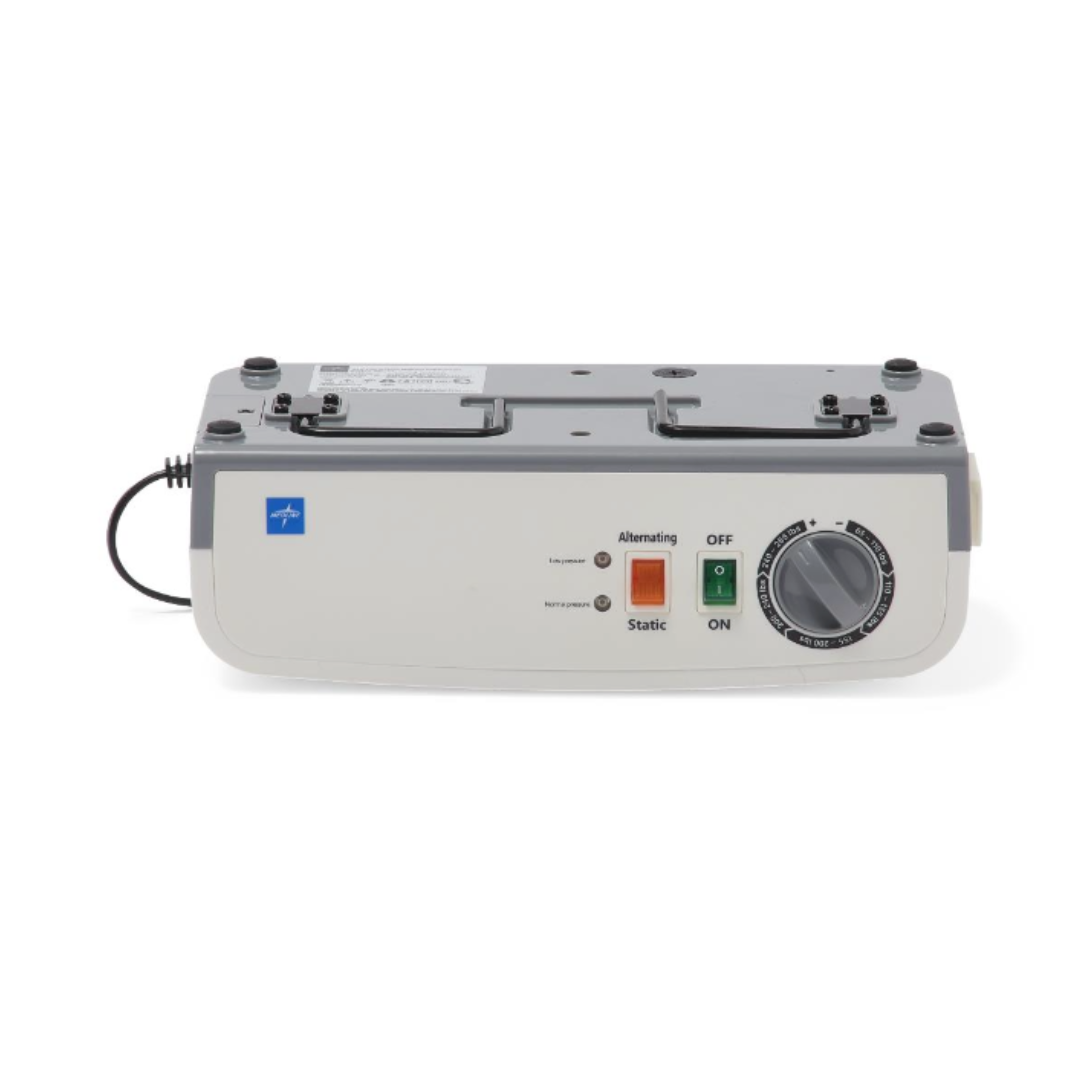The Medline A10 LAL Alternating Pressure Mattress System is a rectangular device with a power cord, control buttons, on/off switch, dial, indicator lights, and labeled settings for Alternating and Static to help prevent pressure injuries.