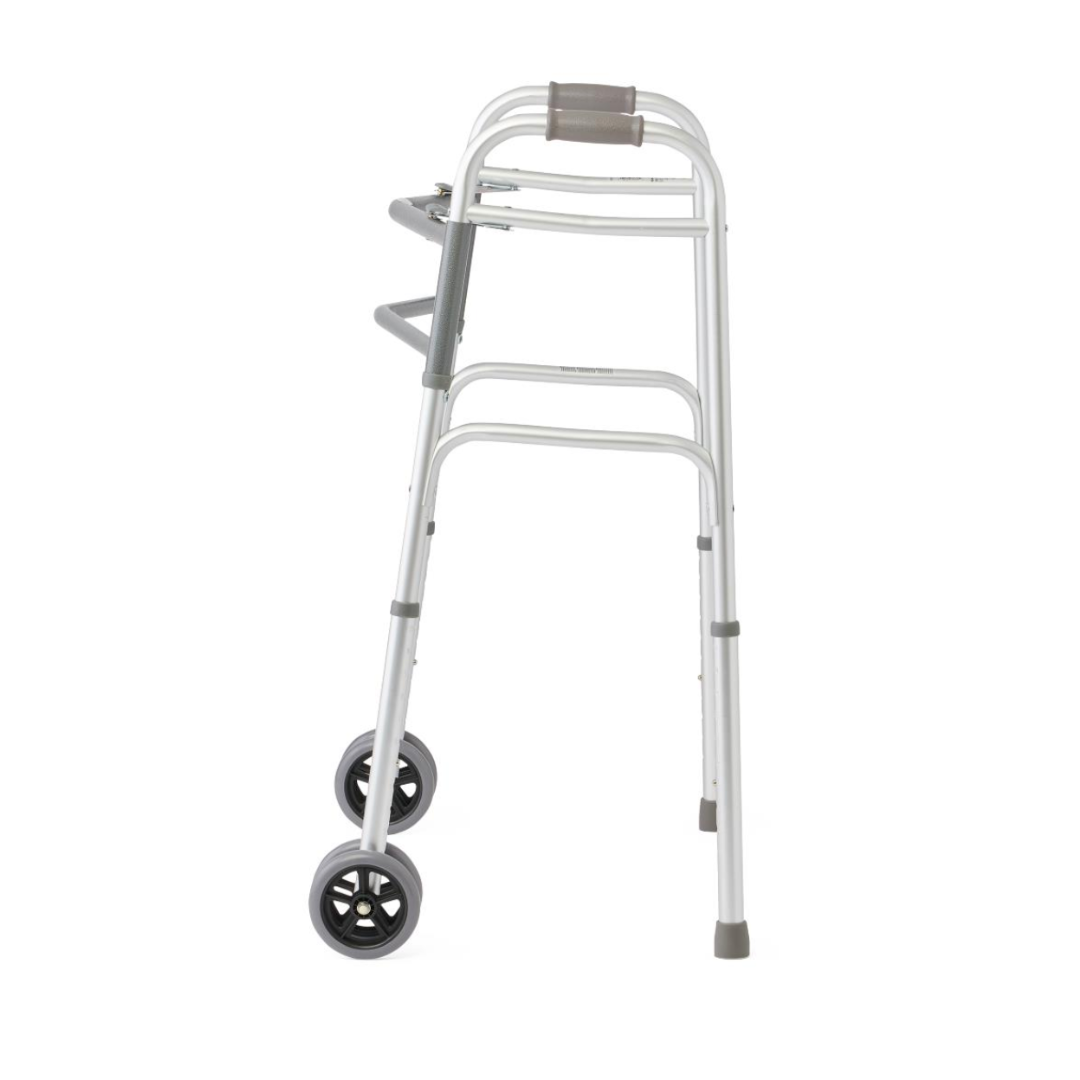The Medline Bariatric Folding Walker with XL Wheels features an extra-wide silver frame, two front wheels, gray rubber grips, and is crafted from lightweight aluminum. It offers a high weight capacity, easy mobility, and has rubber tips on the back legs for added stability.