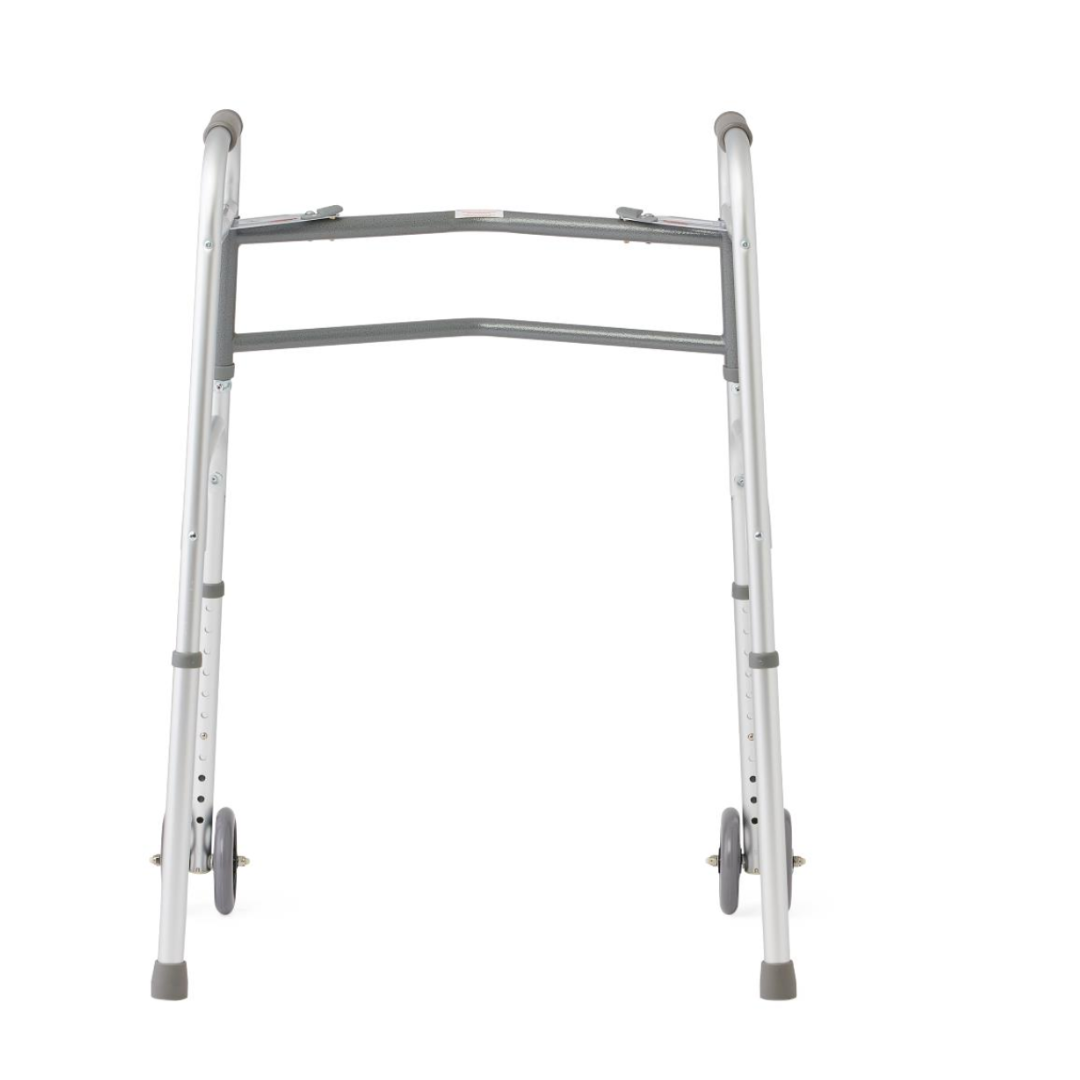 The Medline Bariatric Folding Walker with XL Wheels is a silver, adjustable walker for mobility assistance. It has two front wheels, rubber grips, and a sturdy extra-wide frame for high weight capacity. Photographed against a plain white background.