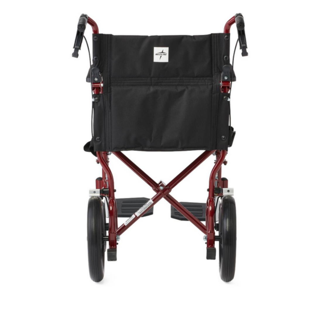 The Medline Lightweight Aluminum Transport Chair features a rear view of its red foldable frame, 12 large rear wheels, footrests, a black seat with handles, and easy-to-use hand brakes for enhanced safety and convenience.