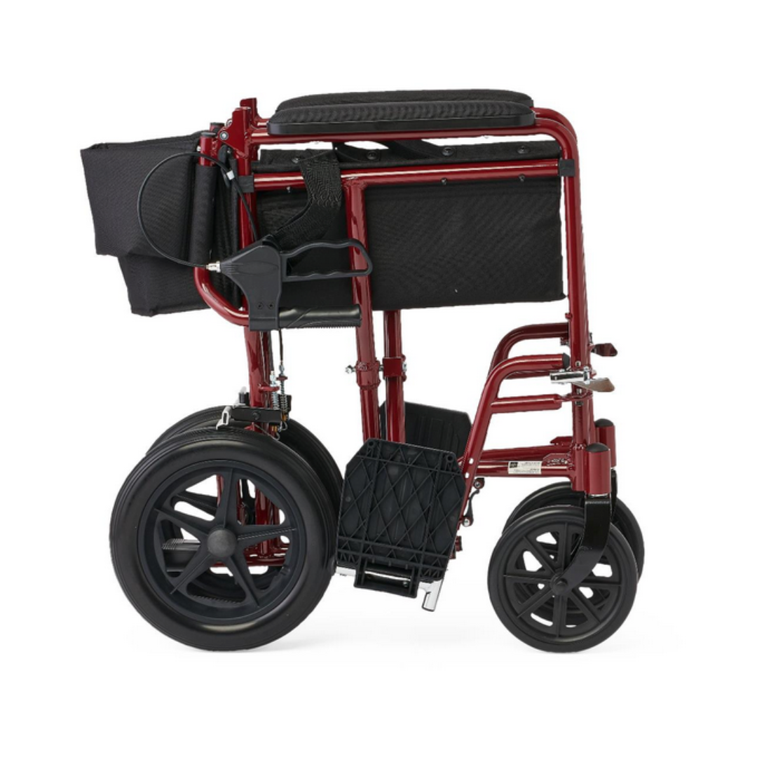 The Medline Lightweight Aluminum Transport Chair with 12 wheels is shown in red with a black seat and backrest. It has large rear wheels, smaller front wheels, hand brakes, a storage pouch on the back, and can be folded for compact storage or transport.