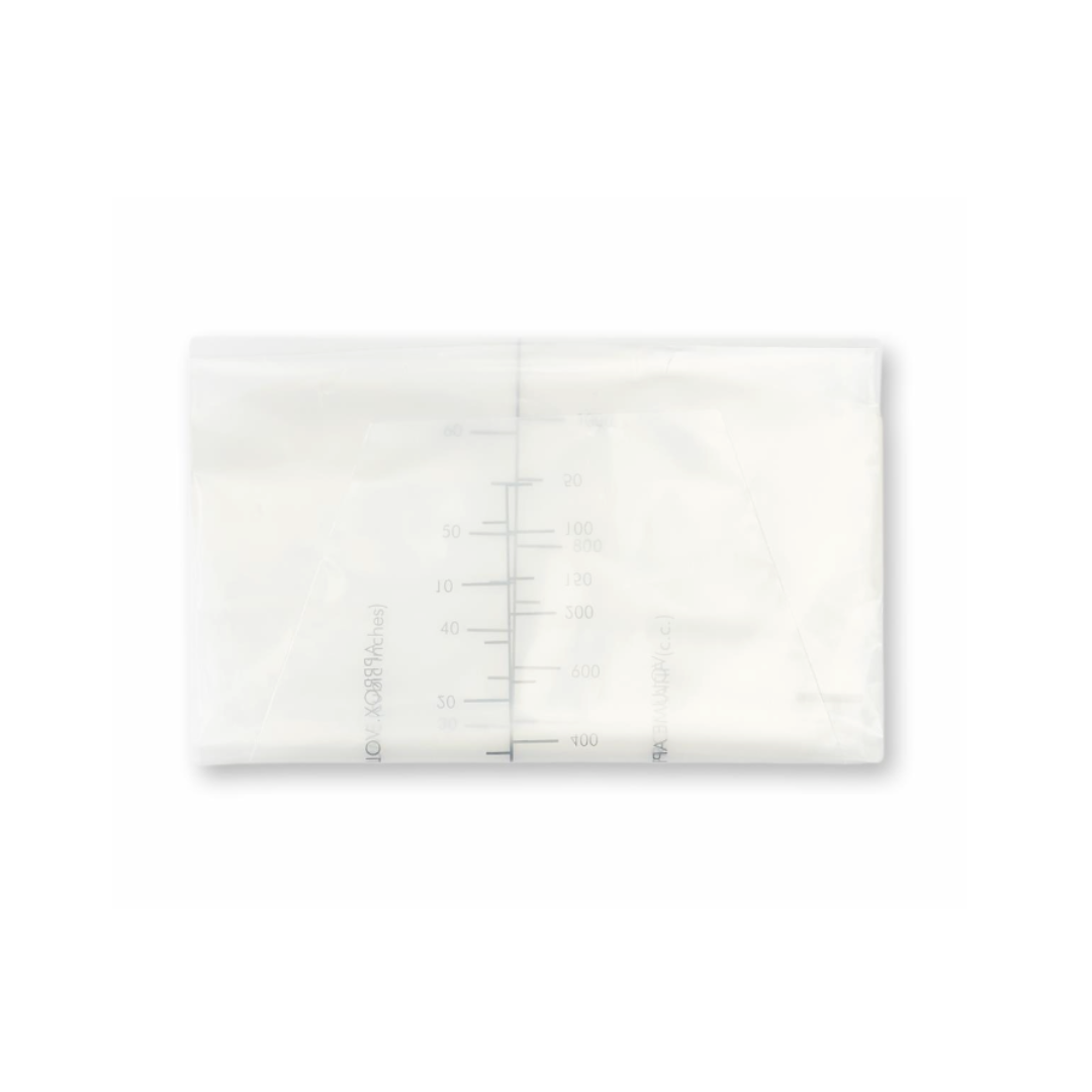 A transparent breast milk storage bag filled with milk lies flat, featuring milliliter measurement markings on the front similar to those on Medline Emesis Bags with Paper Funnel.