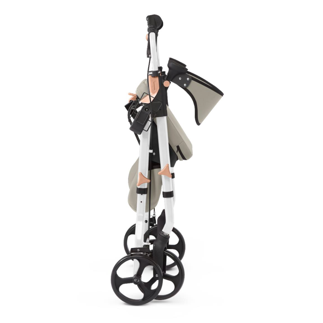 The Medline Empower Rollator with Microban, featuring a beige and black color scheme, durable aluminum construction, and four wheels for enhanced mobility assistance, is shown folded in profile view on a white background.