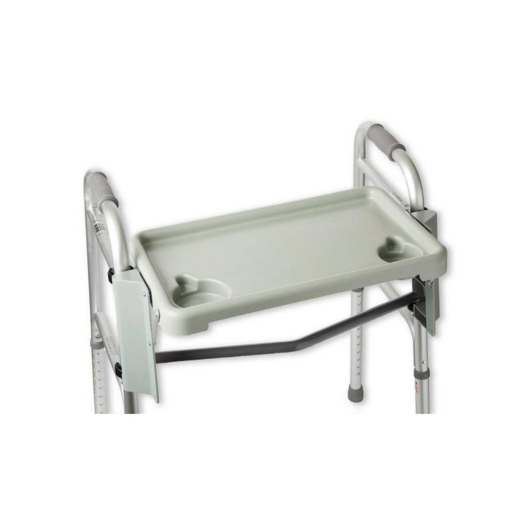 The Medline Folding Tray For Bariatric Walkers attaches securely to a metal walker, offering a flat gray surface with two cup holders for carrying items—making it a practical Medline walker accessory.