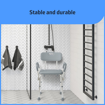 A textured white tile wall accentuates the Medline Shower Chair, complete with slip-resistant, padded armrests and backrest. Two dark towels hang nearby. Above, Stable and durable is inscribed in a blue area.