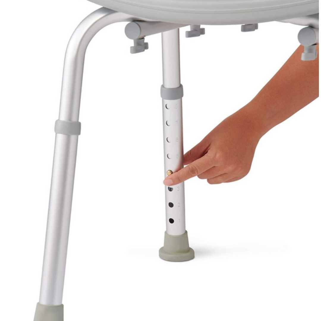 Press a button on the metal leg to adjust the Medline Aluminum Bariatric Shower Chair with Backrest. Its aluminum construction supports up to 400 lb., and gray rubber tips ensure stability on any floor.