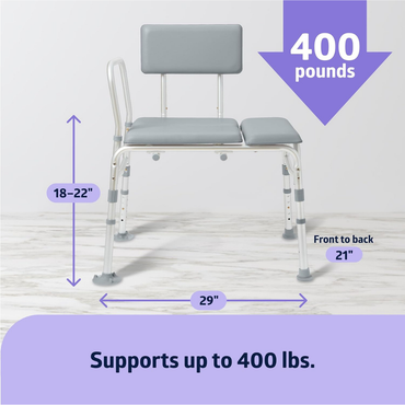 The Medline Bariatric Padded Bathtub Transfer Bench in gray, with backrest and arm support, rests on a marble floor. It features adjustable height (18–22”), measures 29” wide by 21” deep, and supports up to 400 lbs.