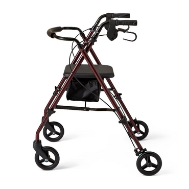 The Medline Superlite Folding Steel Rollator is a red, four-wheeled walker with black handlebars, a seat, and an under-seat storage pouch. It features a compact folding design with ultra-lightweight steel, height-adjustable arms and legs, plus handle brakes for safety.