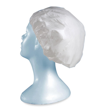 A blue mannequin head models a Medline ReadyBath Rinse-Free Conditioning Shampoo Cap, translucent white and designed to extend for full hair coverage, set against a plain backdrop.