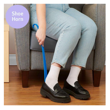 A person sits on a gray chair using the Medline Reach, Grab and Go Kit for Caregivers to put on a black loafer over white socks. Medline Reach appears in a purple circle at the top left, highlighting this mobility aid.