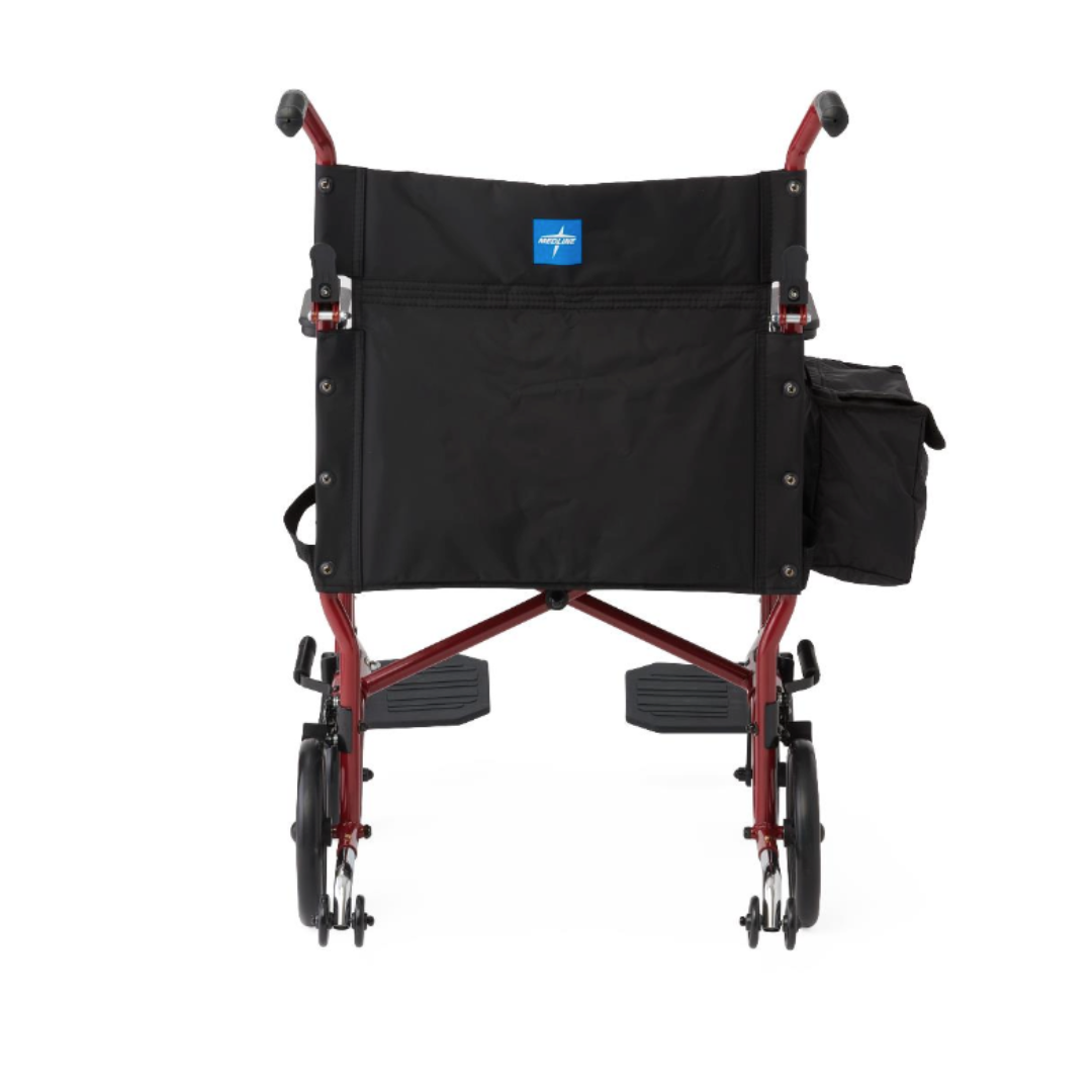 Rear view of a Medline Steel Transport Chair with Wide 19" Seat, featuring a red frame, black seat and backrest, small wheels, and a side pocket on the right armrest—ideal for convenient travel.