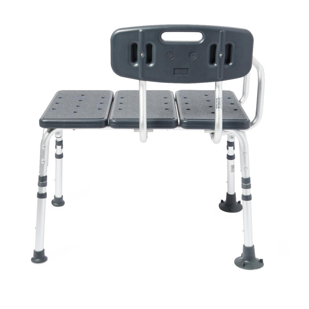 The Medline Tub Transfer Bench with a reversible backrest, gray in color, features adjustable legs, a rust-resistant aluminum frame, non-slip rubber feet, and a wide seat with drainage holes to aid safe transfers into or out of the bathtub or shower.