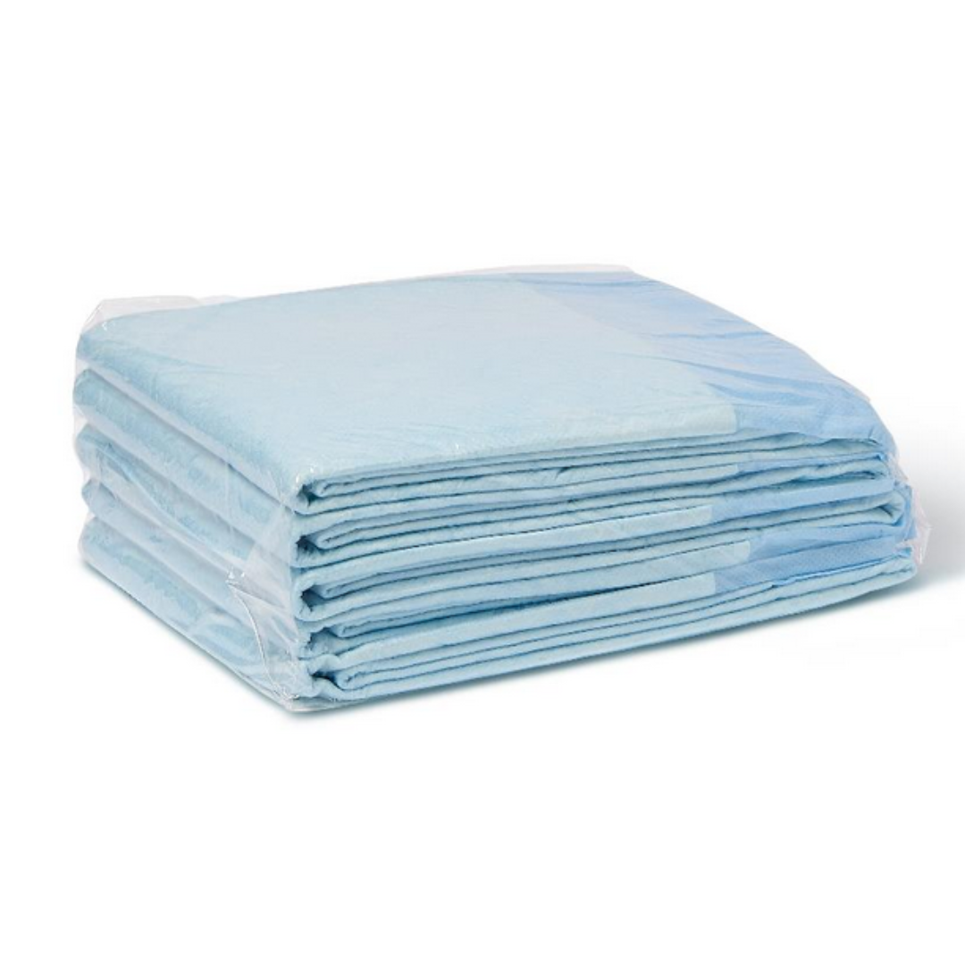 A stack of Medline Disposable Fluff and Polymer Underpads - Heavy Absorbency, in blue, is neatly folded and wrapped in clear plastic, offering reliable moisture protection.