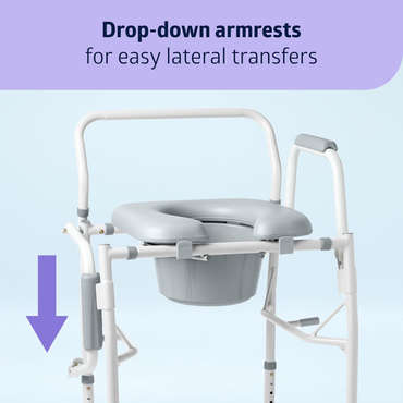 The Medline Steel Drop-Arm Bedside Commode with Padded Seat features drop-down armrests, highlighted by a purple arrow, allowing easy lateral transfers. Its grey padded seat and bucket ensure an accessible toilet chair experience.