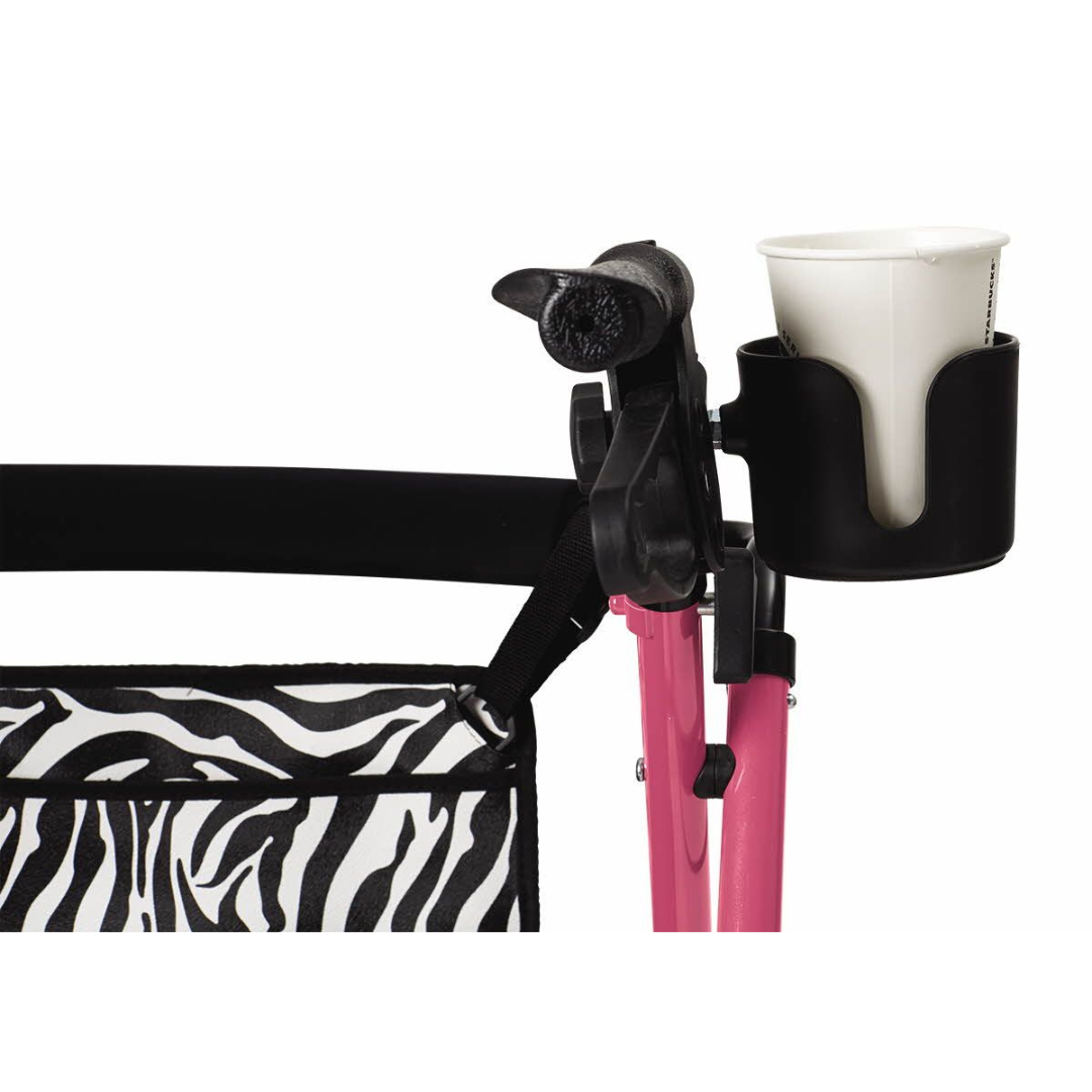 The Medline Posh Pink Zebra Rollator features a black cup holder on a pink frame, holding a white cup. Its zebra print fabric adds flair, while ergonomic brake handles and mobility support offer stylish functionality and comfort.