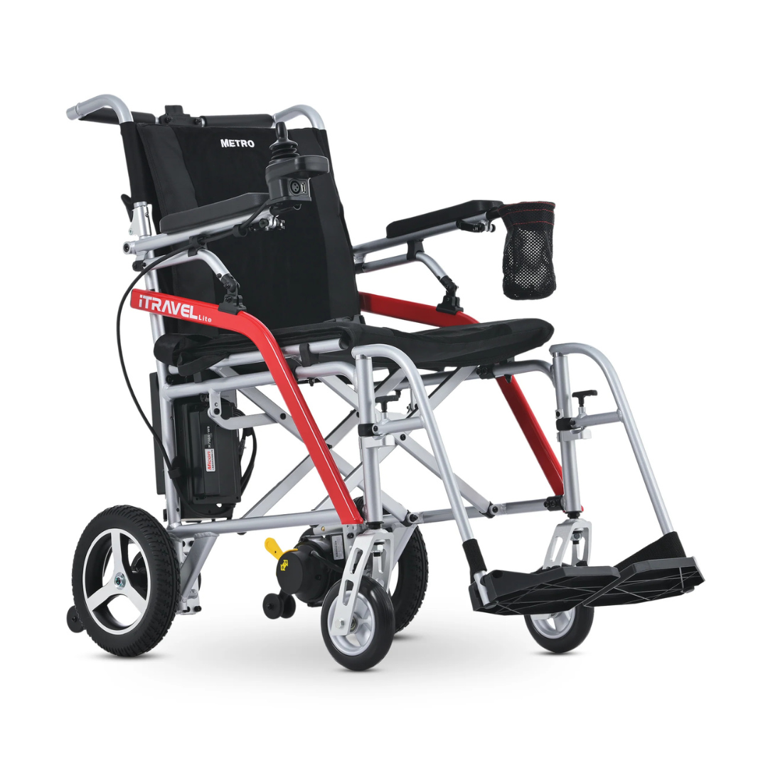 The Metro Mobility iTravel Lite Portable Powerchair is a lightweight, foldable electric wheelchair with a black seat, red and silver frame, small front wheels, large rear wheels, and a black armrest pouch—ideal for airplane travel.