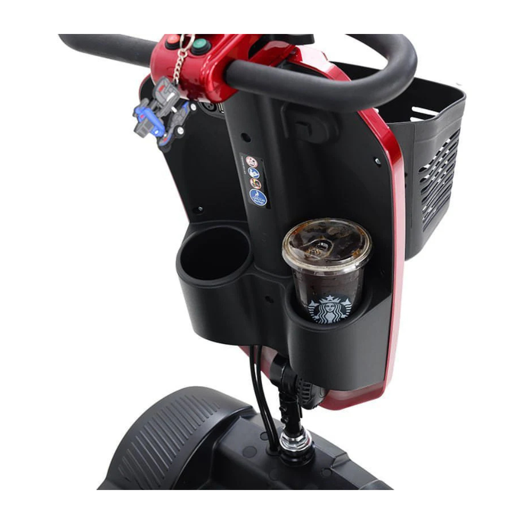 Close-up of the metro Mobility MAX Plus Scooter’s handlebar area with cup holders—one holding an iced coffee—keys, and a front basket. This scooter features a 300W motor and provides up to a 16-mile range for daily errands.