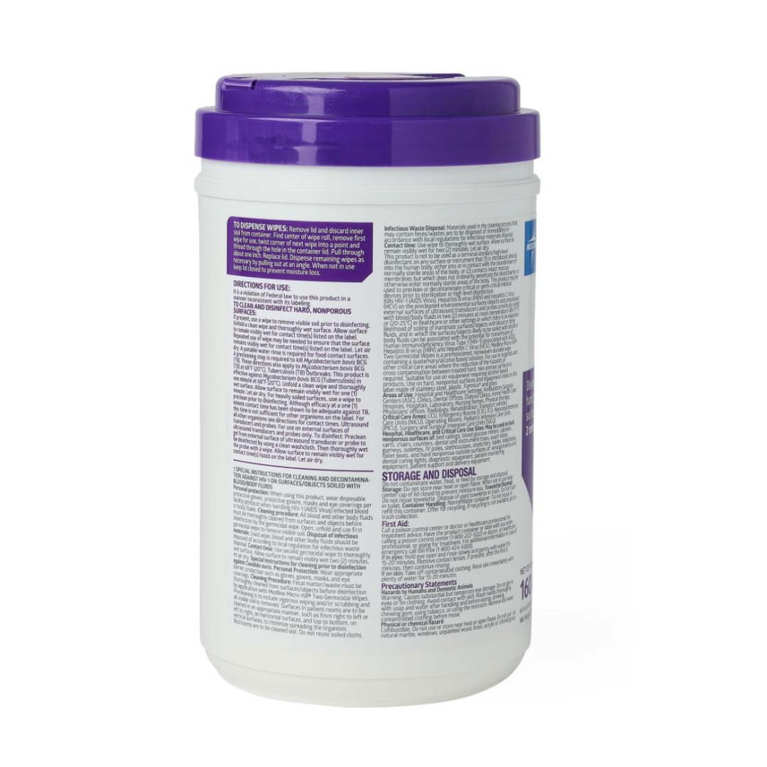 A white canister with a purple lid labeled with instructions, warnings, and ingredients contains Micro-Kill Two Disinfectant Wipes for cleaning hard surfaces. The product is shown against a plain white background.