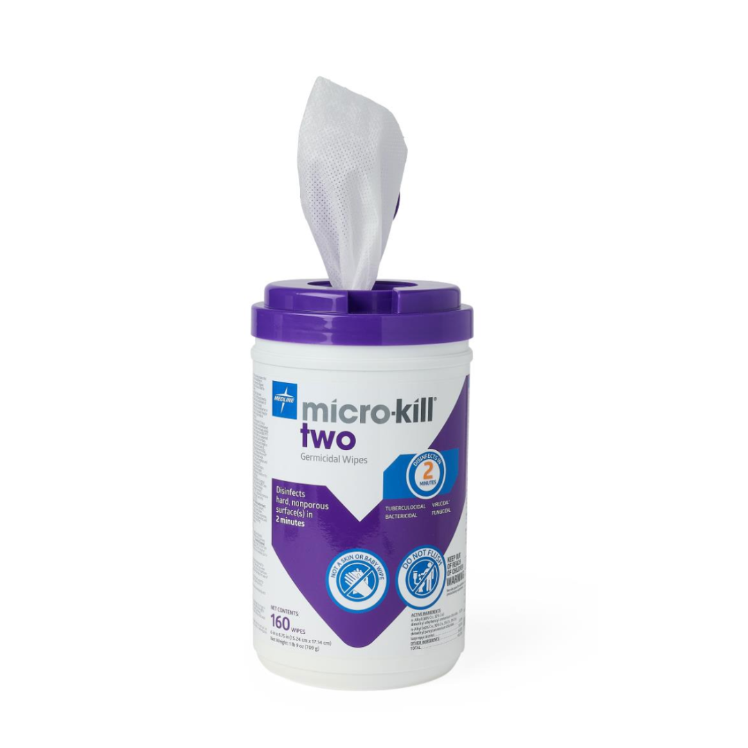 A container of Micro-Kill Two Disinfectant Wipes with a purple lid and a white wipe being pulled out; the label highlights its hard surface cleaning power and antibacterial and antiviral protection.