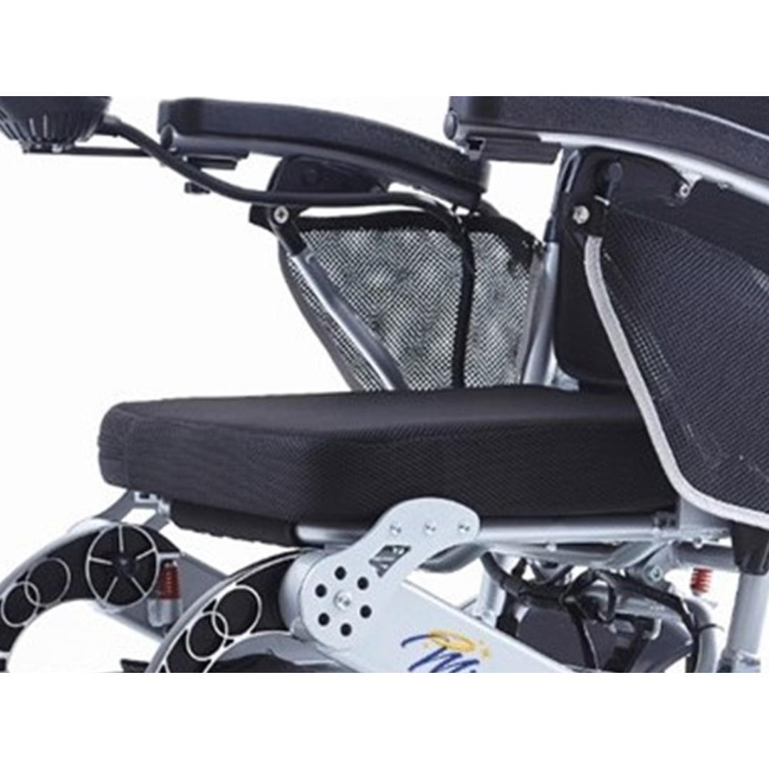 Close-up of a black and silver Miracle Mobility Platinum 8000 Bariatric Portable Powerchair seat with mesh side pockets and armrests visible, plus parts of the wheels and powerchair frame.