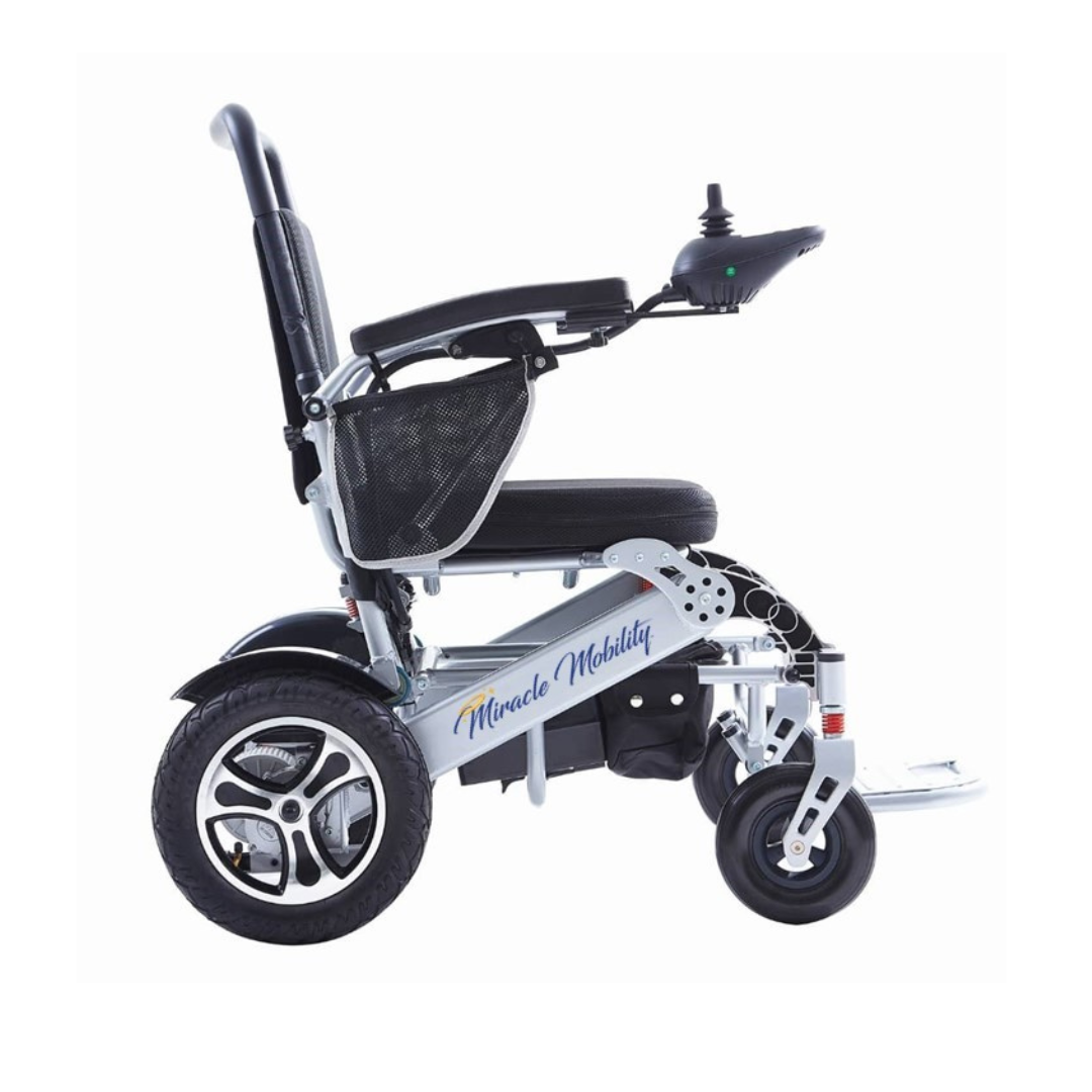 A side view of the Miracle Mobility Platinum 8000 Portable Powerchair - Open Box, a modern, lightweight mobility chair featuring large rear wheels, joystick control on the armrest, and Miracle Mobility branding on the frame.