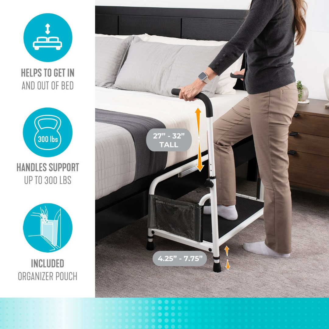 A woman uses the Stander Step Bedside Platform with LED Lighting, featuring a white bed assist rail (adjustable 27”-32” tall, 4.25”-7.75” wide), supporting up to 300 lbs. Includes organizer pouch and pairs well with non-slip step for added safety.