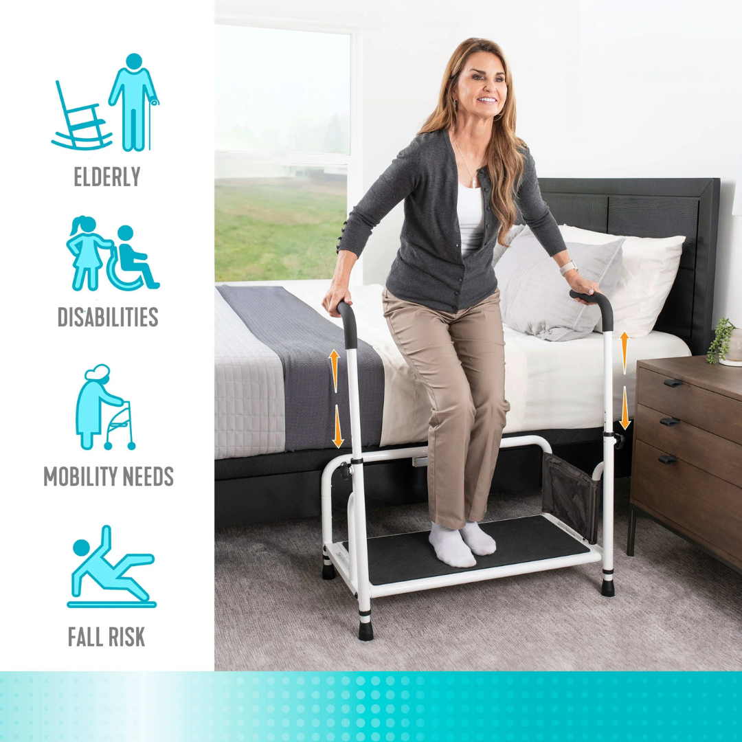 A woman uses the Stander Step Bedside Platform with LED Lighting, featuring handrails and a non-slip step, to safely get out of bed. Icons show it's ideal for seniors, disabilities, mobility support, and fall prevention. The room has a bed, nightstand, lamp, and window.