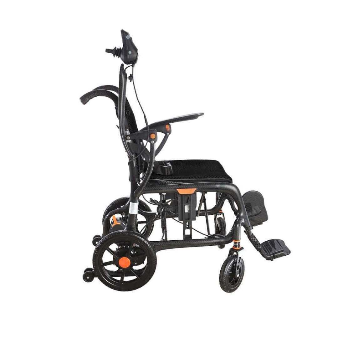 The Foldawheel Model CX Lightweight Portable Powerchair, weighing only 28 lbs, is shown in black with armrests, right-hand joystick control, footrest, and small front and rear wheels, viewed from the side on a white background.