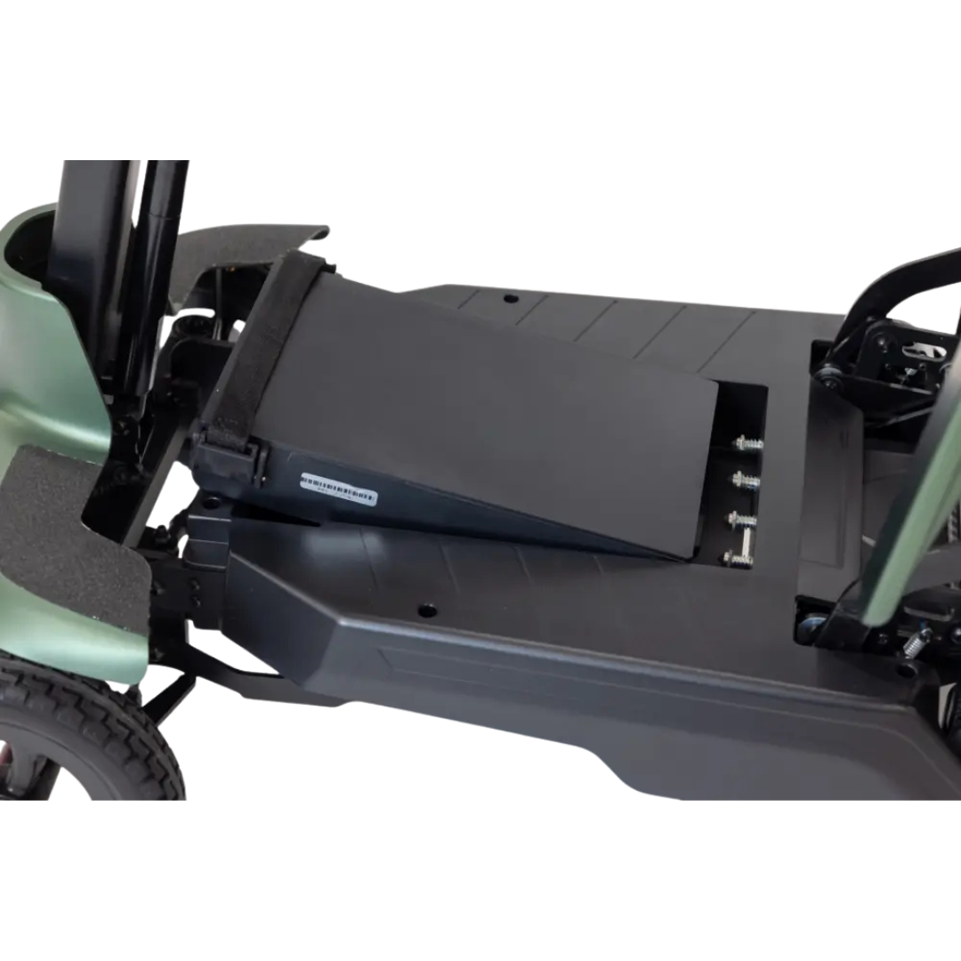 Close-up of the Monarch Smarti Plus Ultra-Lite Auto Folding Scooter’s removable black battery pack installed on the footrest, with visible screws and parts of the scooter's frame and wheels.