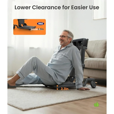A man in pajamas sits on a VOCIC AX35 Movable Electric Chair & Floor Lift with 4 wheels and a 2.3-inch low base.