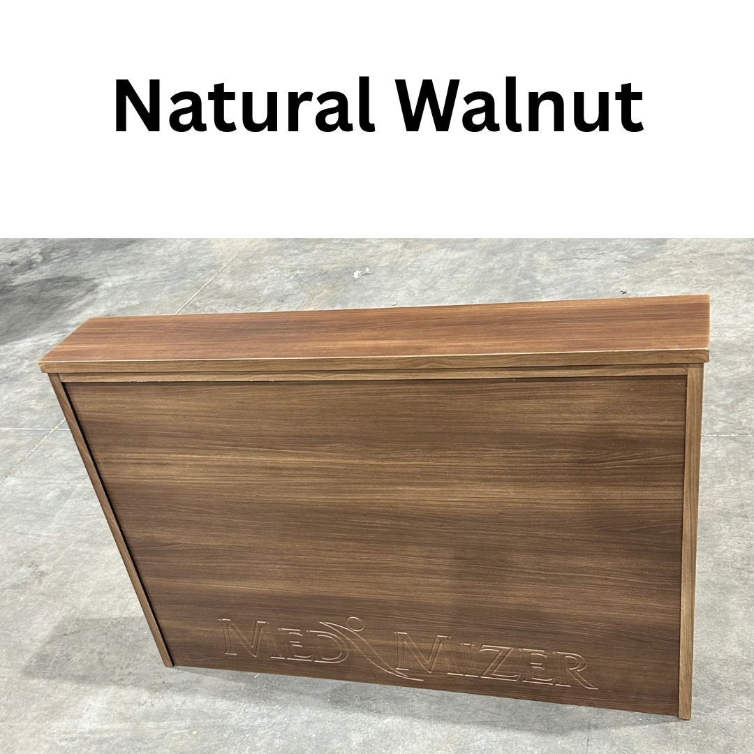 A smooth walnut-finished wooden panel stands on a gray floor with "Med-Mizer" engraved on the front, indicating compatibility with the Med-Mizer ActiveCare Rotating Hospital Bed. "Natural Walnut" is printed above in bold black letters.