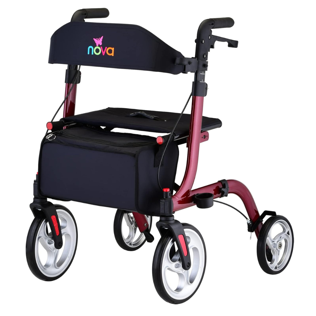 The Nova Medical Express All-Terrain Euro-Style Rollator is red with four large wheels, ergonomic handles, padded seat, black storage bag, sturdy frame, backrest, and a multicolored brand logo on its folding back support.