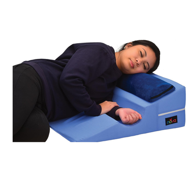 A person lies comfortably on their side using the Nova Bed Wedge for Back & Side Sleepers with Half Roll Pillow Insert (2 Pack), enjoying supportive relaxation—ideal for side sleepers.