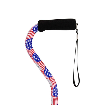 The Nova Designer Offset Walking Cane features a black foam handle, wrist strap, and a patriotic red, white, and blue American flag with stars pattern on the shaft.
