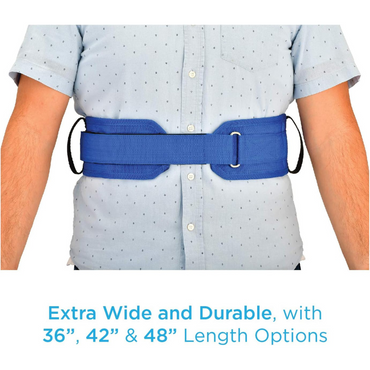 A person models the Nova Transfer Gait Belt with Grip Handles in blue, worn over a light blue shirt with black dots. Caption: Extra Wide and Durable, available in 36, 42, & 48-inch lengths for secure transfer support.