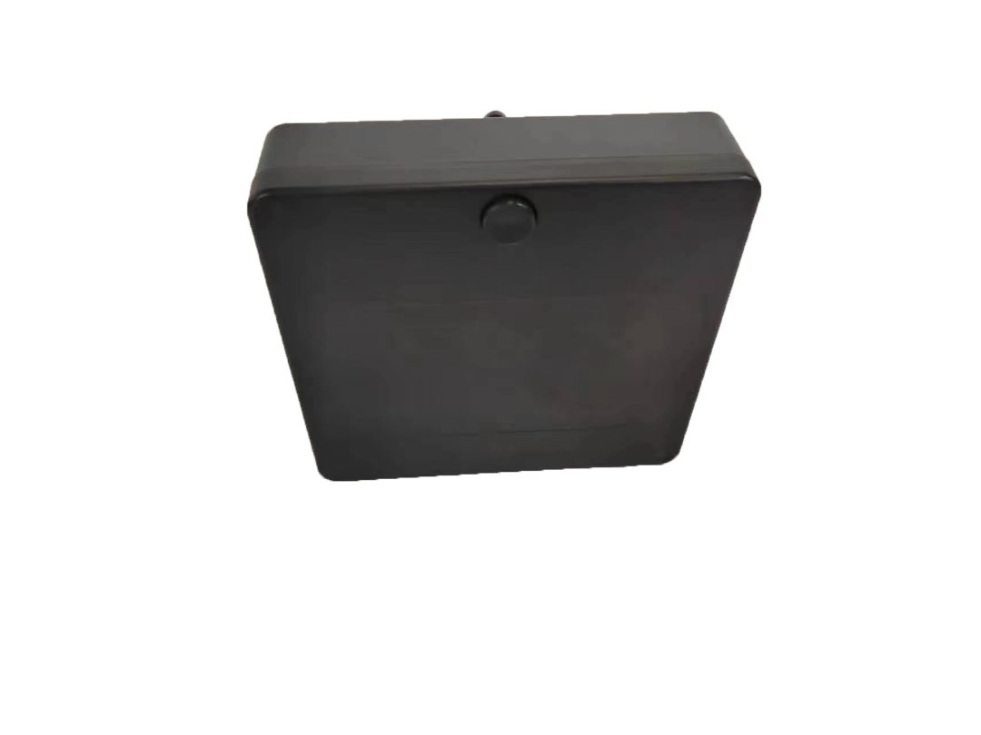 A black, square-shaped plastic enclosure with rounded edges and a small circular protrusion on one side, reminiscent of components in the ComfyGo Phoenix Carbon Fiber Electric Wheelchair, is isolated on a white background.