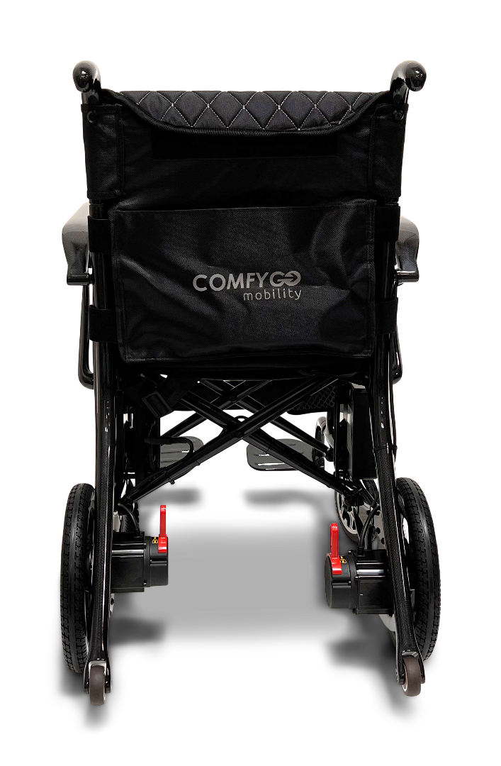 The ComfyGo Phoenix Carbon Fiber Electric Wheelchair features a sleek black design with COMFYGO mobility on the backrest. It boasts a lightweight metal frame, red release levers for compact folding, and modern elegance typical of carbon fiber innovations.