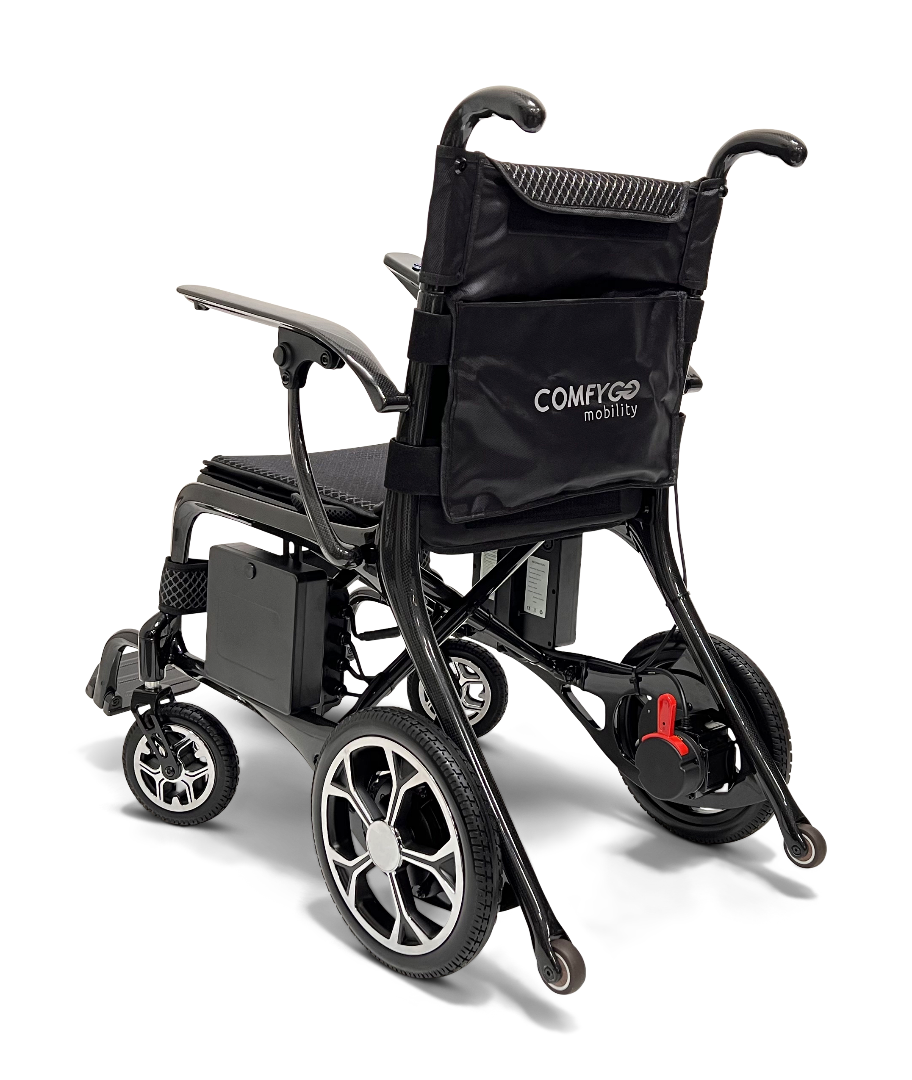 The ComfyGo Phoenix Carbon Fiber Electric Wheelchair is a lightweight, portable option with a black frame and seat. It features small front wheels, larger rear wheels, foldable armrests, and a storage compartment on the backrest. The ComfyGo Mobility brand is subtly displayed.
