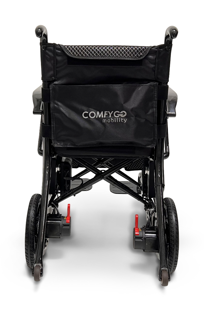 Rear view of the stylish ComfyGo Phoenix Carbon Fiber Electric Wheelchair. The foldable black chair features a mesh backrest, red lever locks on the rear wheels, and the brand name printed on the back for style and convenience on the move.